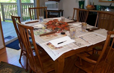 Table of summer crabs on newspapers in Cedar Beach Lodge